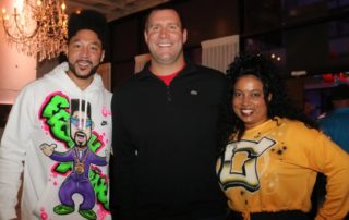 Charlie Batch, Ben Roethlisberger and Tasha Batch smiling at the In The Pocket event