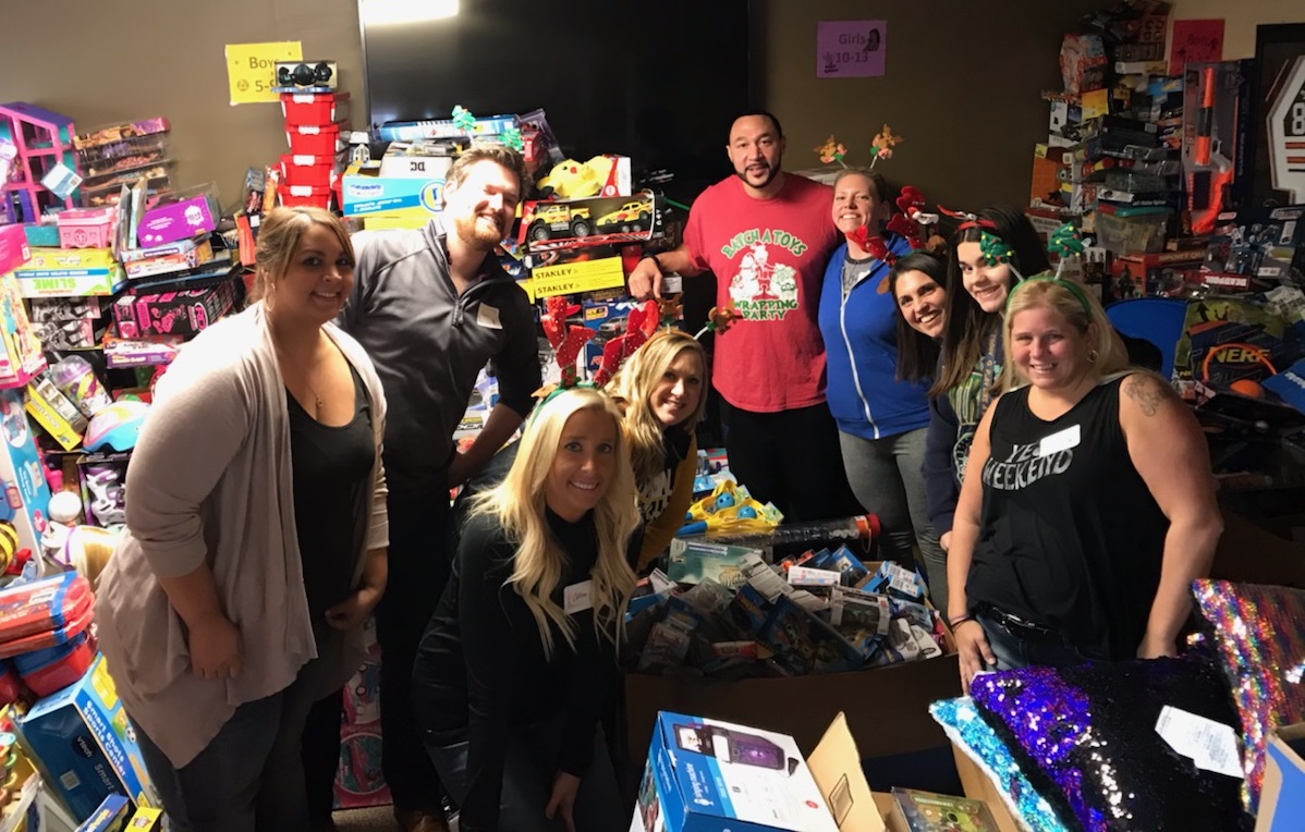 Charlie Batch and volunteers pack gifts for Batch a Toys